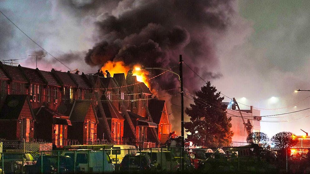 First responders work at the scene of an accident after a small plane crashed in Philadelphia. A private small plane crashed in the middle of a busy area in the north of the city. Photo: Matt Rourke/AP/dpa