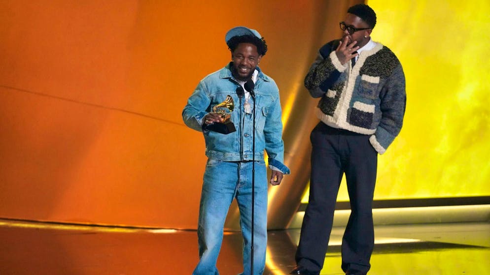 Kendrick Lamar wins Grammy for Recording of the Year - Gallery. Kendrick Lamar (l.) accepts the award for Recording of the Year. The music producer and DJ Mustard is also there.