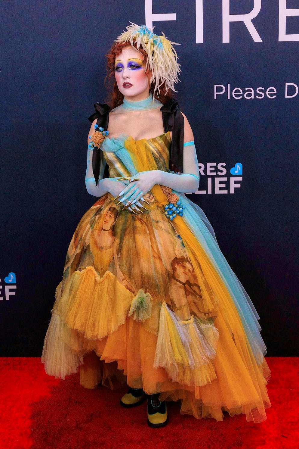 Grammy Awards 2025 - Red Carpet. Chappell Roans transforms herself into a stylized Marie Antoinette with long metallic nails and elaborate make-up.