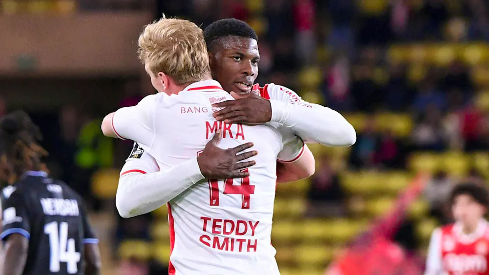 Embolo, who assists twice, and hat-trick scorer Mika embrace.