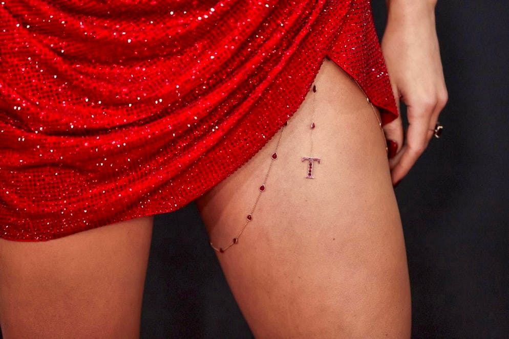 Grammy Awards 2025 - Red Carpet. Hers is adorned with a T-pendant and leads to speculation as to whether it stands for Taylor or Travis?