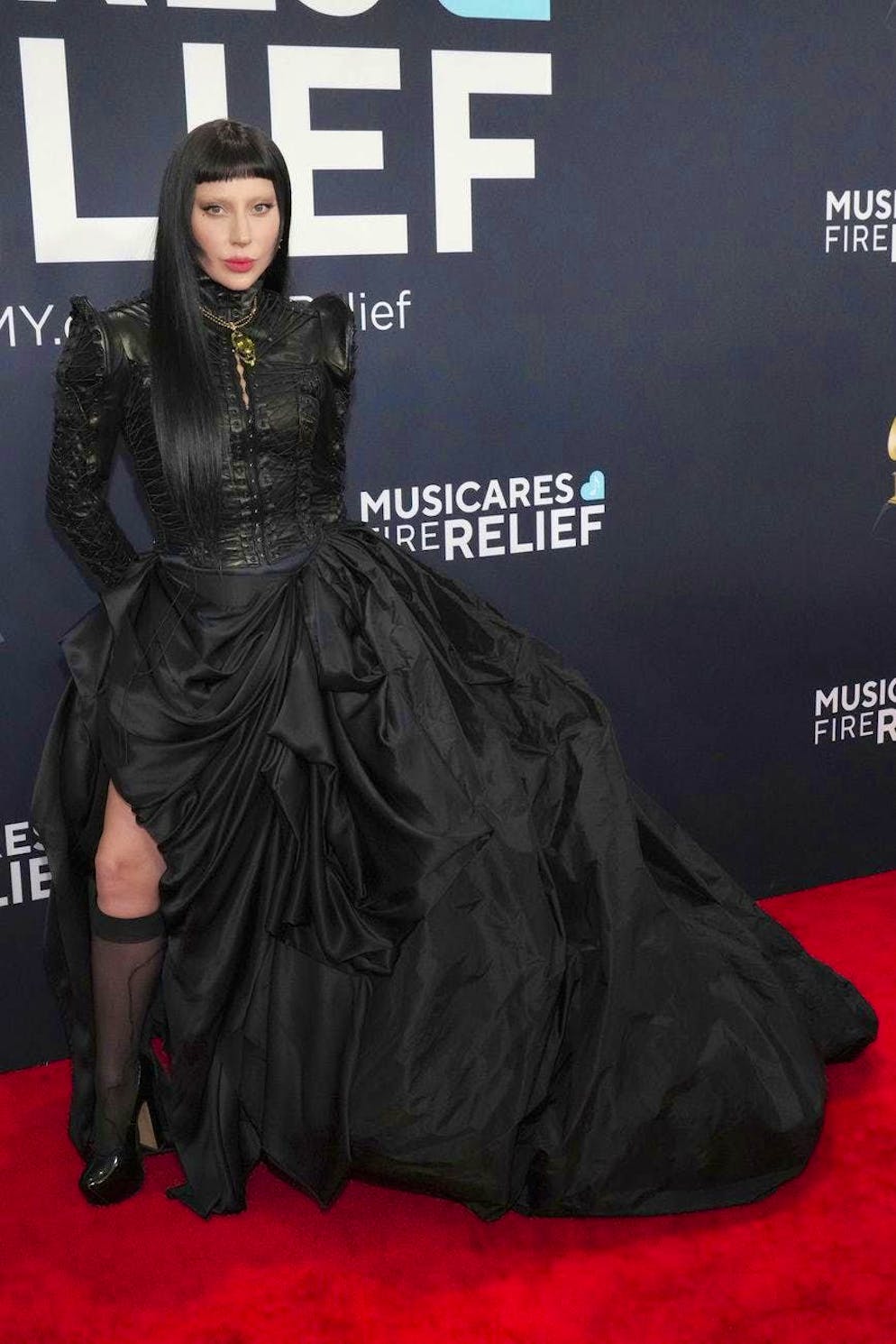 Grammy Awards 2025 - Red Carpet. Lady Gaga created a gothic vibe on the red carpet, arriving at the ceremony in a dramatic dress with a voluminous skirt and leather top with club sleeves.