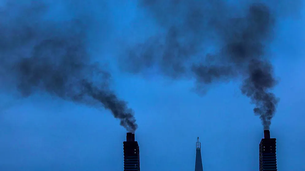 Dark clouds of smoke rise from the chimney of a ferry as it leaves the port in Rostock, Germany. (Archive image)