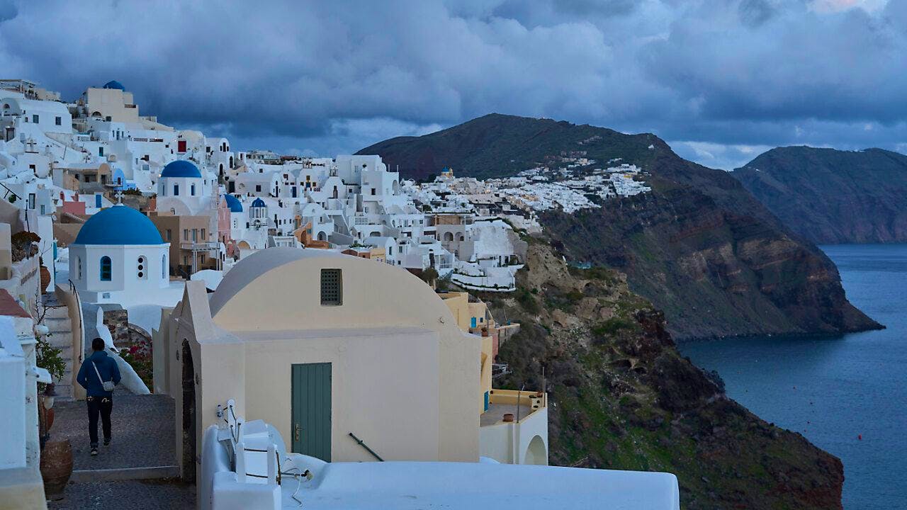 Greece. Only just under a third of Santorini's population left