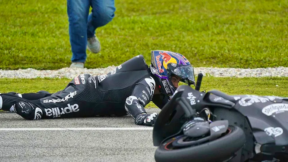 Jorge Martin lies on the ground after his crash