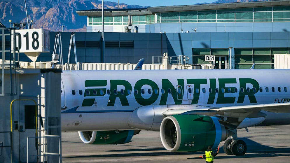 For about two hours, passengers on a Frontier Airlines flight made sure that a rowdy fellow passenger remained calm in his seat.