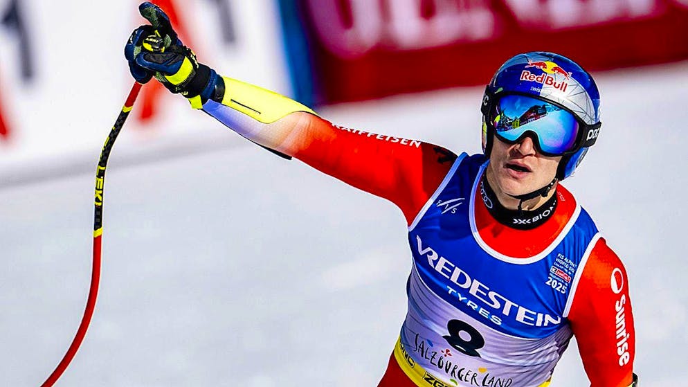 Marco Odermatt is delighted with his perfect run after crossing the finish line.