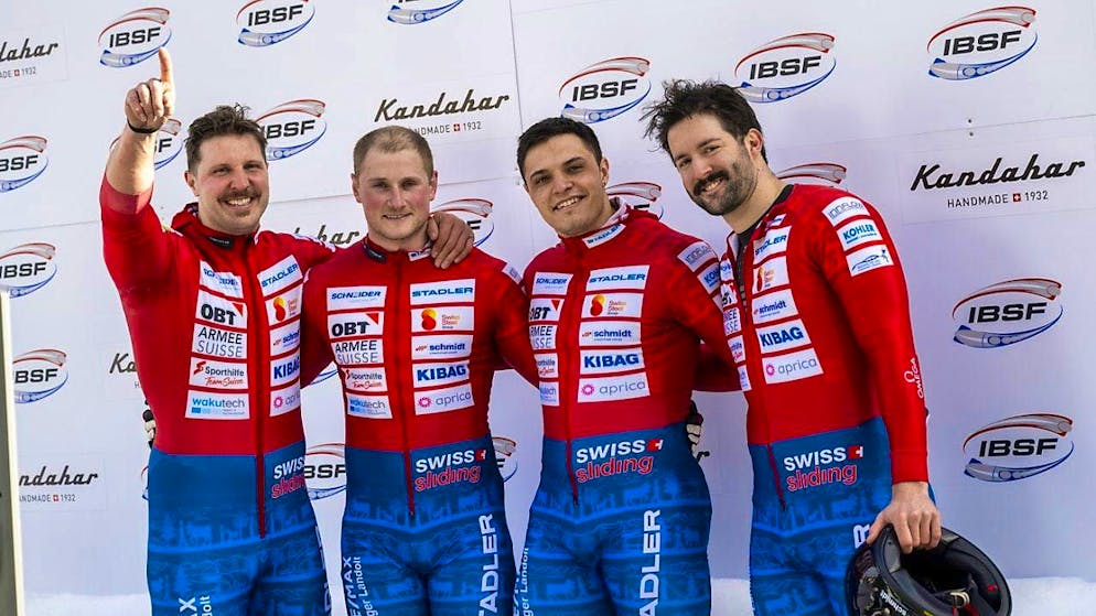 The successful Swiss four-man bobsleigh team with helmsman Michael Vogt (far right)