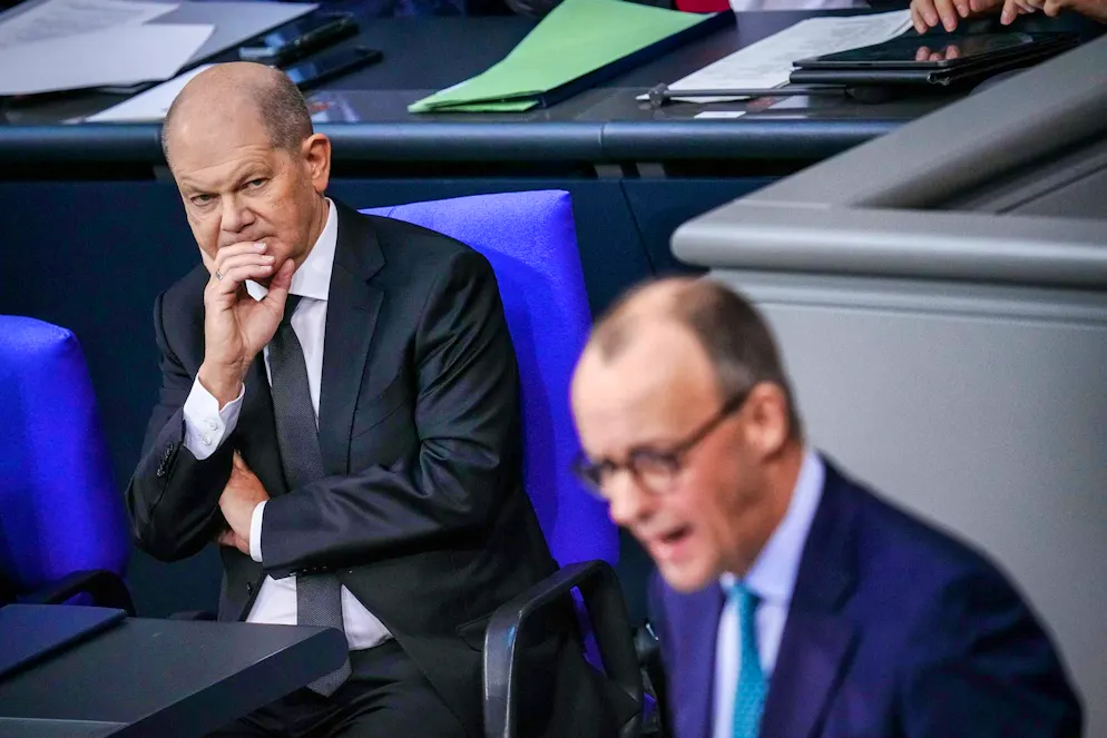 Chancellor Olaf Scholz (left) and Friedrich Merz (right)