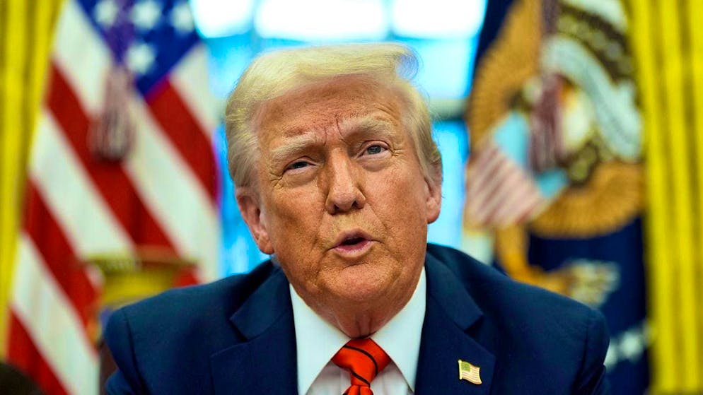 US President Donald Trump speaks to reporters in the Oval Office at the White House. Photo: Alex Brandon/AP/dpa