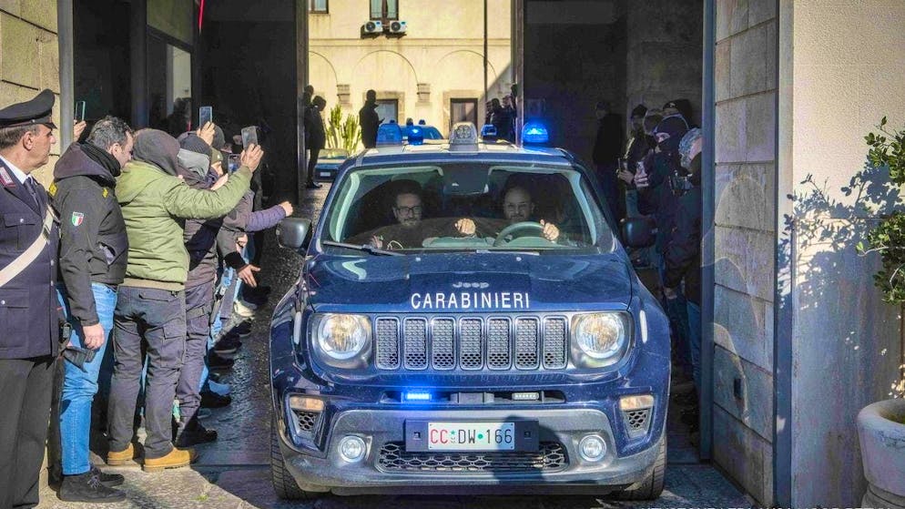 Police officers from the Italian Anti-Mafia District Directorate, Palermo Division, take part in a police operation in Sicily on February 11, 2025.