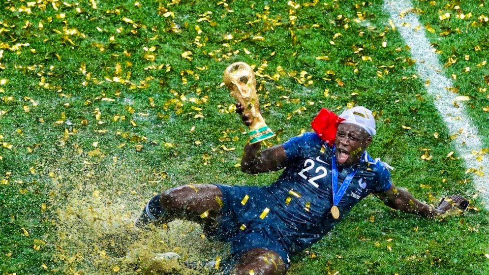 Benjamin Mendy celebrates France's World Cup in 2018 in the inclined rain of Moscow