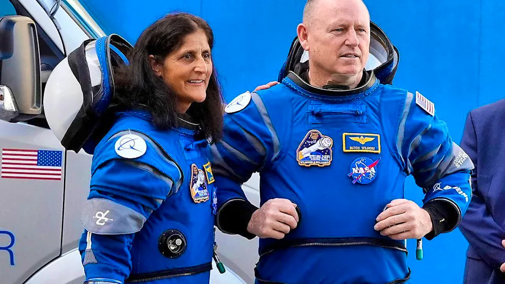 ARCHIVE - Nasa astronauts Suni Williams (l) and Barry 'Butch' Wilmore chat with family members as they leave the Operations and Checkout Building to head to the launch pad at Space Launch Complex 41. Photo: John Raoux/AP/dpa