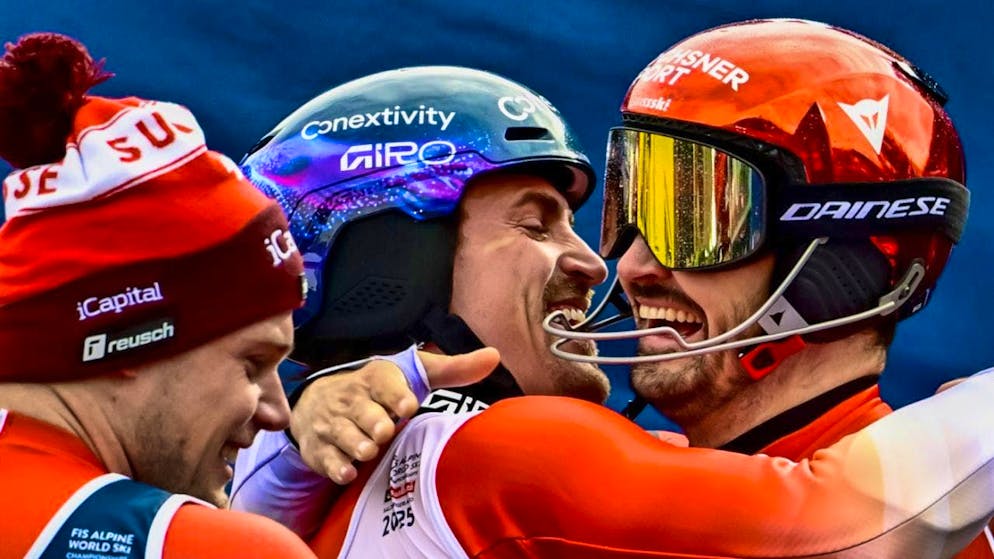 Collective happiness: Marc Rochat hugs Loïc Meillard, the competitor from his own camp