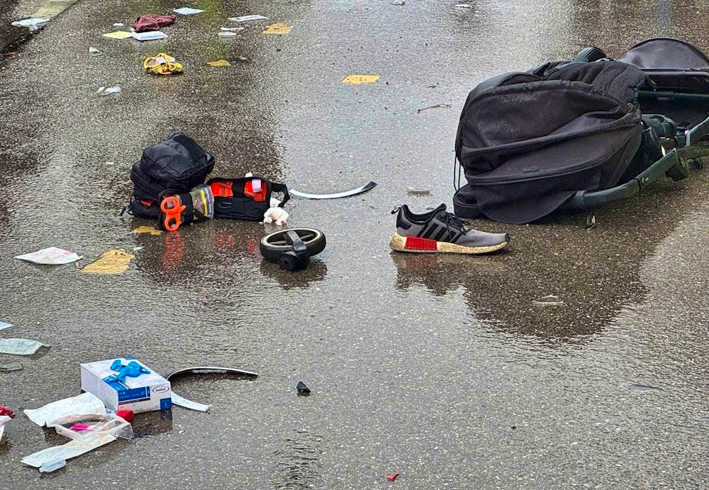 Vehicle driven into group of people in Munich - Gallery. A baby carriage is lying near the scene.