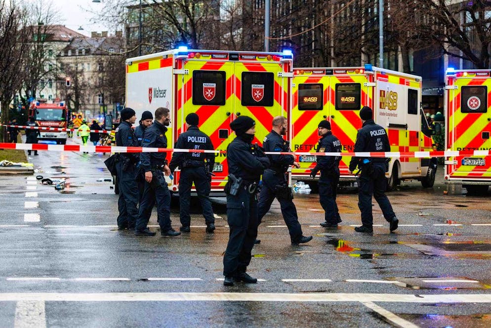 Vehicle driven into group of people in Munich - Gallery. Rescue workers stand near the scene.