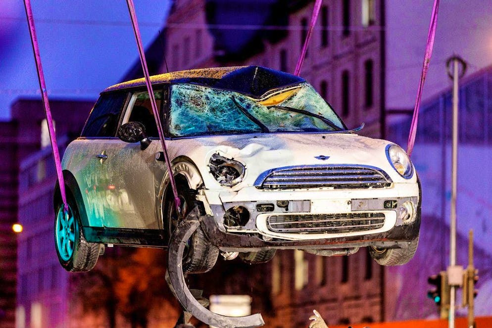 Vehicle driven into group of people in Munich - Gallery. A car is lifted onto a tow truck at the scene. A car has driven into a group of people in Munich city center.