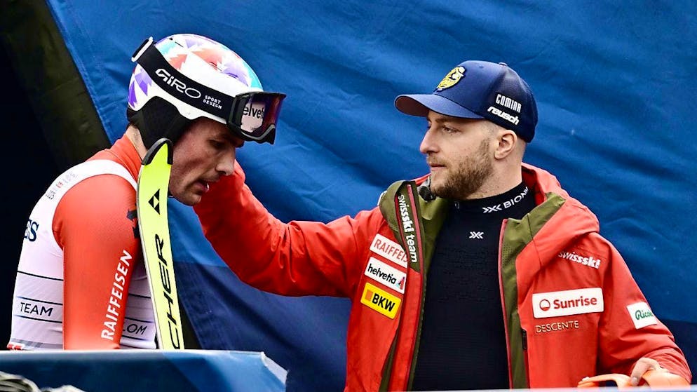 Justin Murisier (right) withdraws from the giant slalom after the combined downhill due to knee problems