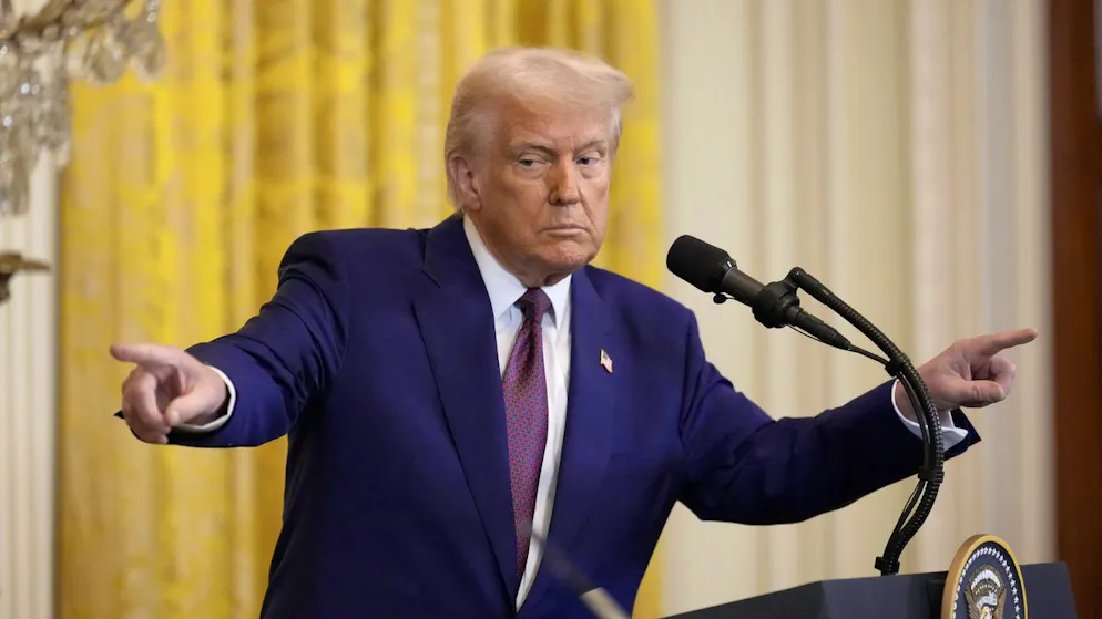 President Donald Trump points to a reporter and India's Prime Minister Narendra Modi during a news conference in the East Room of the White House, Thursday, Feb. 13, 2025, in Washington. (