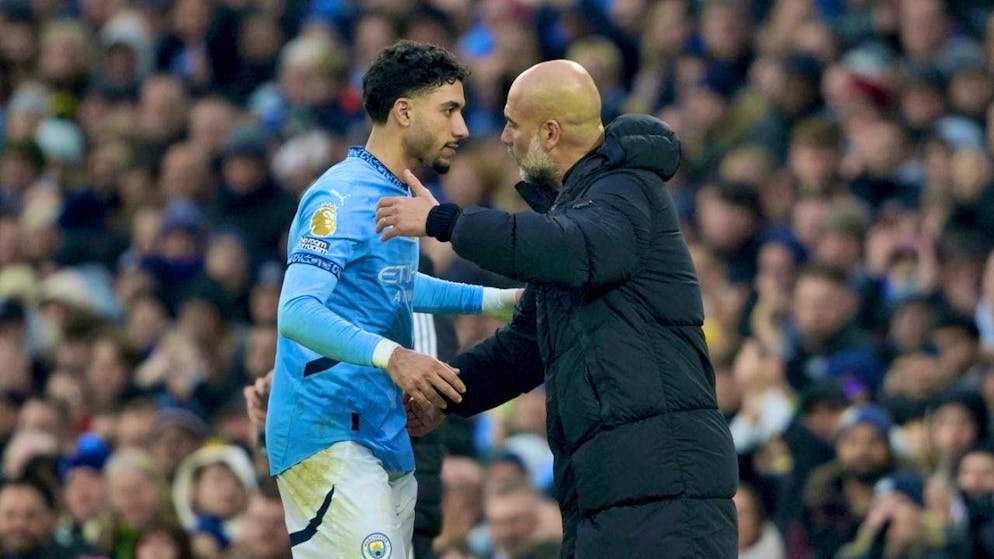 Coach Pep Guardiola congratulates Omar Marmoush on his three goals against Newcastle United