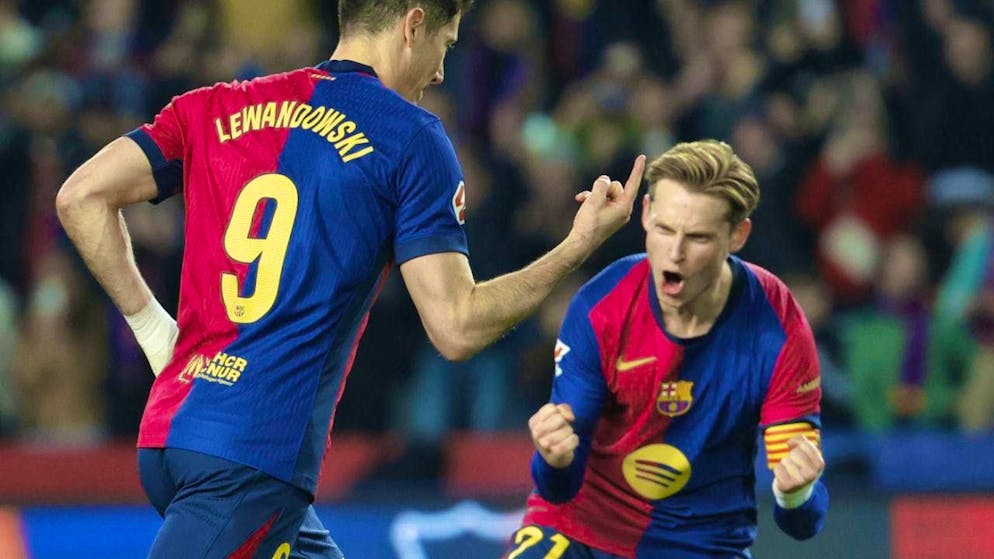Barcelona's Robert Lewandowski is celebrated after scoring a penalty against Rayo Vallecano