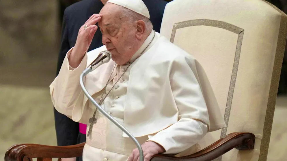 Pope Francis makes the sign of the cross at the beginning of his weekly general audience in Paul VI Hall at the Vatican. Photo: Alessandra Tarantino/AP/dpa