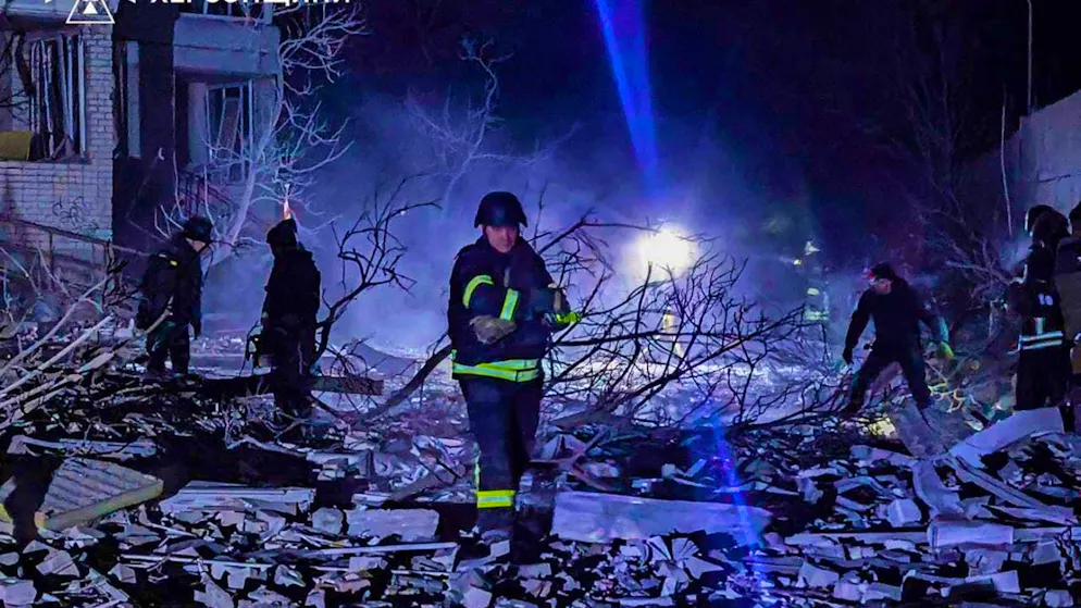 HANDOUT - Rescue workers clear the rubble of a multi-storey building in Kherson. Photo: Ukrainian Emergency Service/AP/dpa - ATTENTION: For editorial use only in connection with reporting and only with full attribution of the above credit