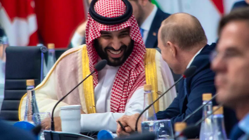 ARCHIVE - Vladimir Putin (r), President of Russia, and Mohammed bin Salman, Crown Prince of Saudi Arabia, laugh shortly before the start of the plenary session at the G20 summit in Buenos Aires. Photo: Carlos Brigo/dpa/Archive image