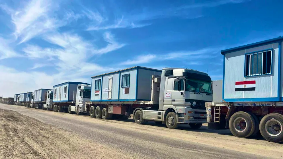 ARCHIVE - Numerous trucks with mobile houses are parked on the Egyptian side of the Rafah border crossing in preparation for transportation to the Gaza Strip, at the Rafah border crossing. ) Photo: Mayar Mokhtar/AP/dpa