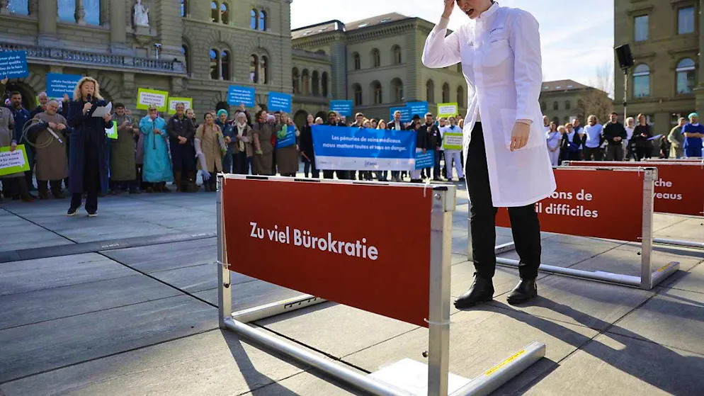 Members of five medical associations protest on the Bundesplatz in Bern against the bottlenecks in medical care. During an action, the obstacles in the profession were illustrated with a hurdle race.