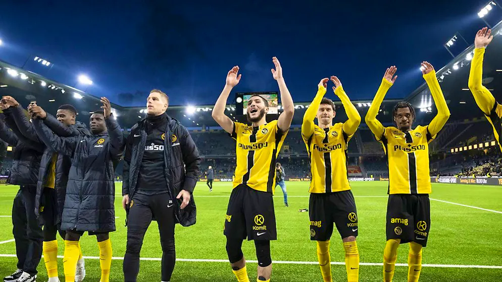 Jaouen Hadjam (in the middle) is celebrated by the YB fans