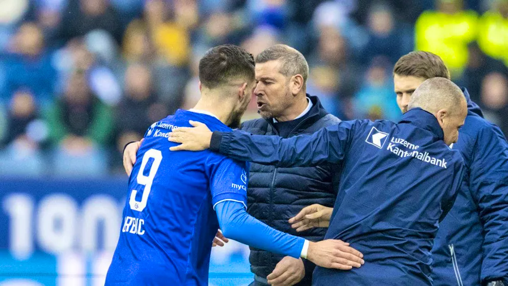 Goalscorer Adrian Grbic celebrates with coach Mario Frick
