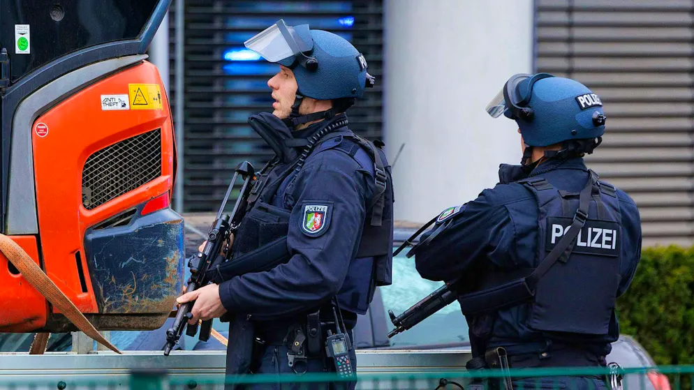 Heavily armed and protected: Numerous police officers are also on the scene after the shooting