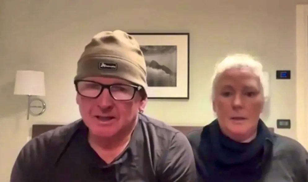 The couple had to sit next to a corpse on the plane.