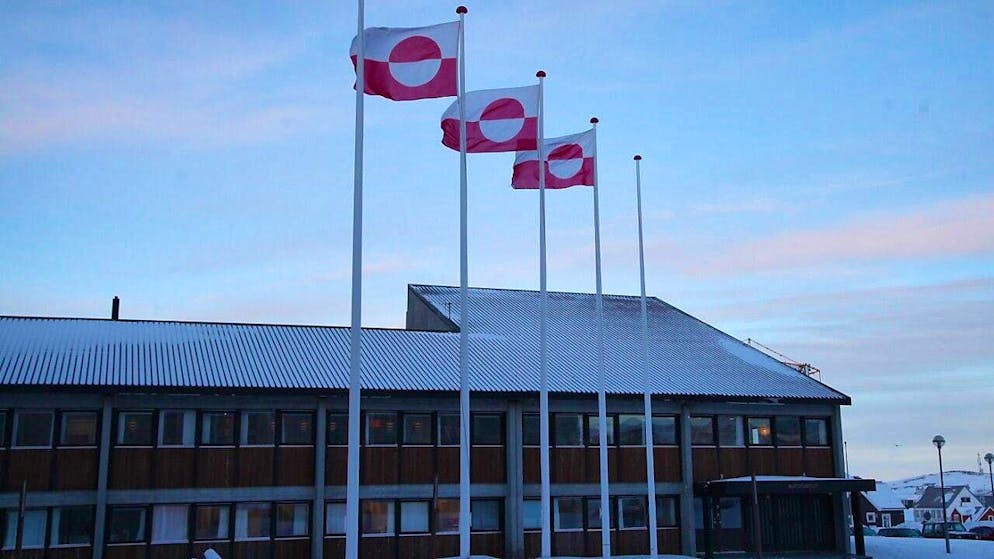 ARCHIVE - Greenlandic flags fly in front of the parliament Inatsisartut in the capital Nuuk. Photo: Steffen Trumpf/dpa