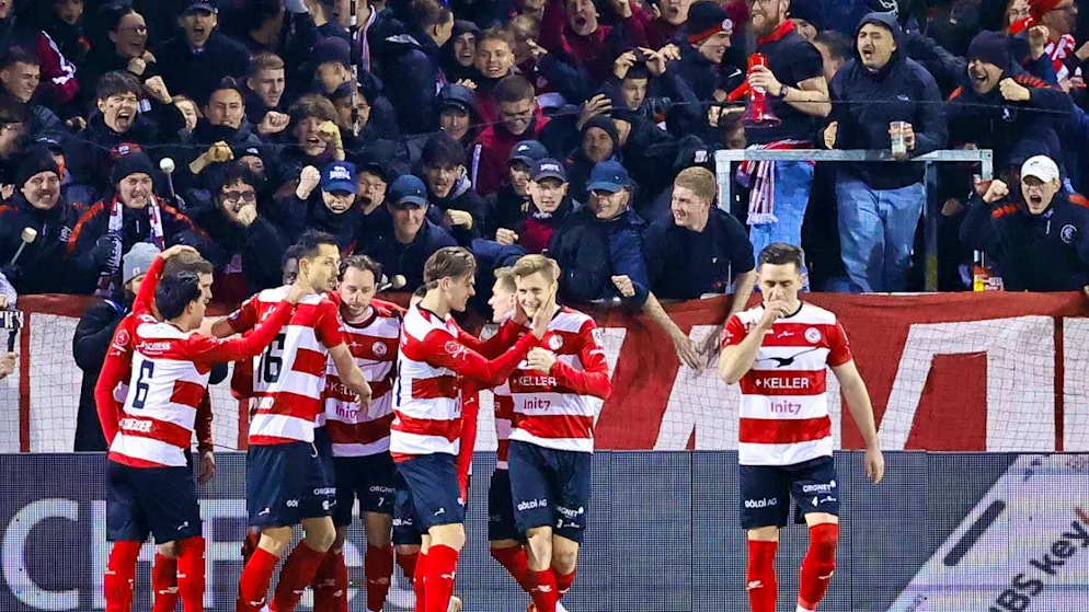 Luca Zuffi celebrates with his team-mates after the 2:0 win