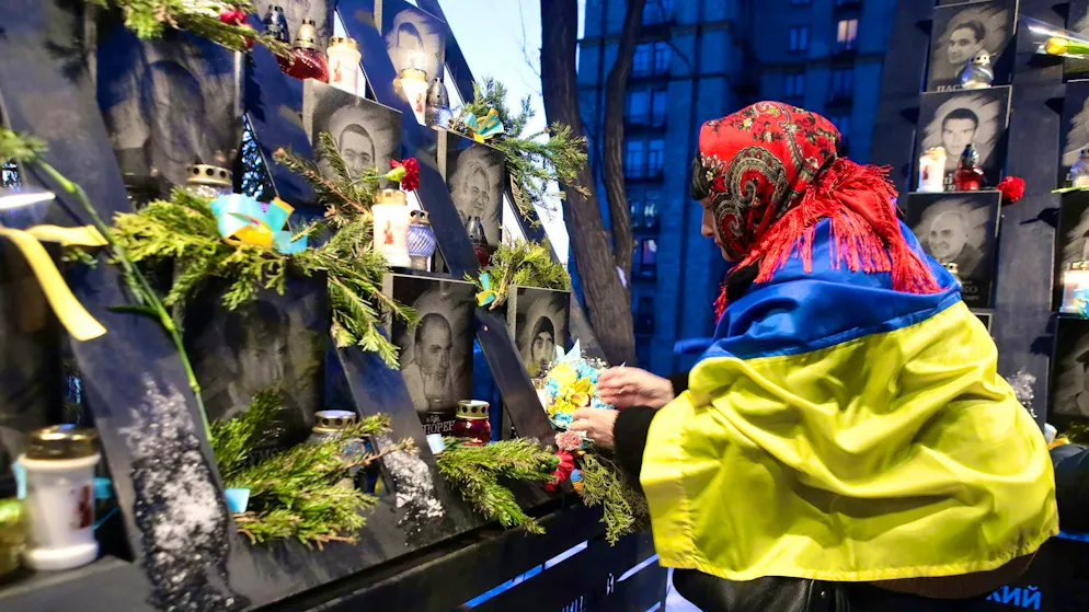 A woman mourns the dead in Kiev. 