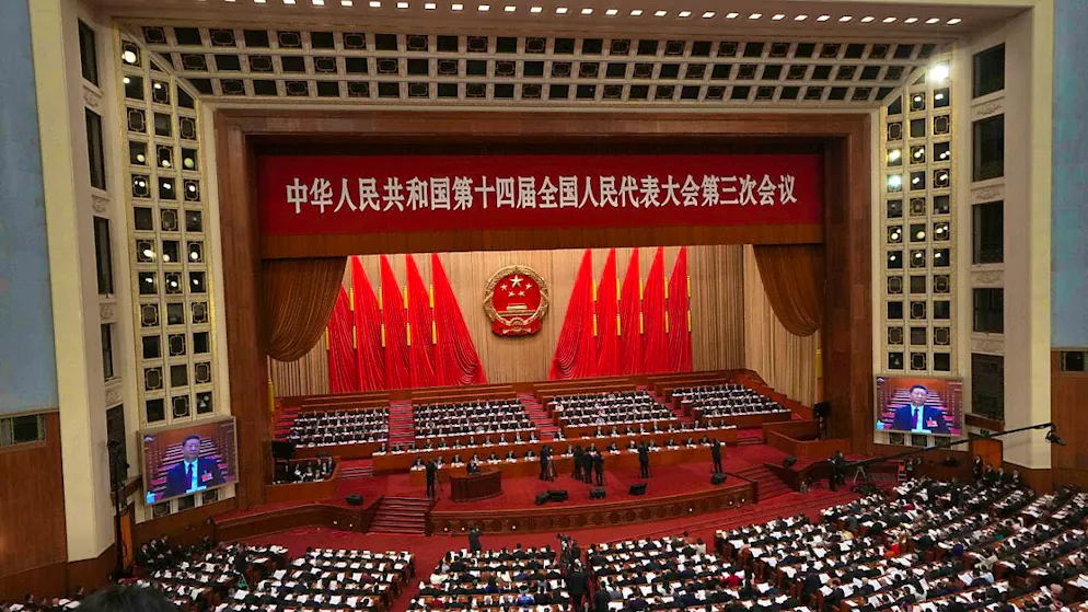 Chinese President Xi Jinping is shown on screens during the opening session of the National People's Congress (NPC) in the Great Hall of the People. Photo: Ng Han Guan/AP/dpa