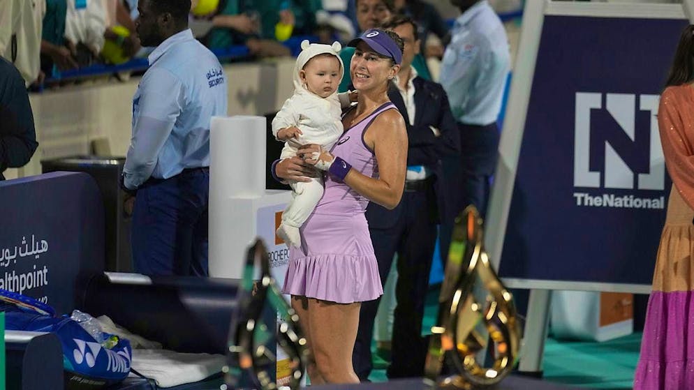 Belinda Bencic shows off her daughter Bella after her tournament win in Abu Dhabi