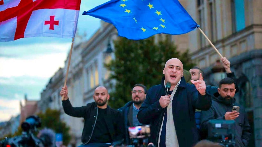 ARCHIVE - Nika Melia of the Coalition for Change speaks to the crowd during a rally against alleged violations in the recent parliamentary elections. Photo: Zurab Tsertsvadze/AP/dpa