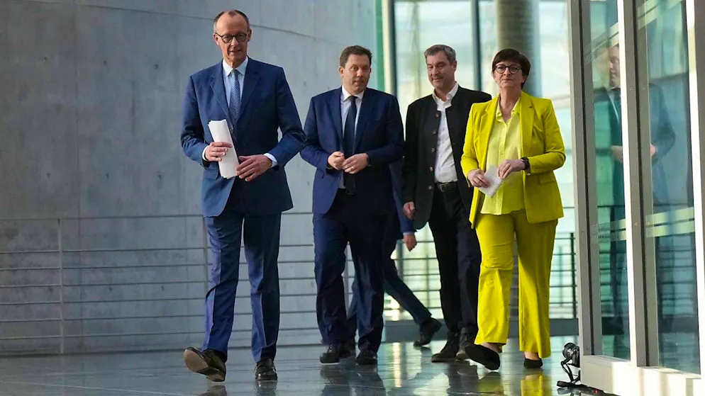 Friedrich Merz, CDU chancellor candidate and CDU federal chairman, Lars Klingbeil, SPD federal chairman and SPD parliamentary group leader, Markus Söder (CSU), Minister President of Bavaria and CSU chairman, and Saskia Esken, SPD federal chairman, take part in a press conference after the exploratory talks between the CDU/CSU and SPD in the Bundestag. CDU, CSU and SPD sounded out whether coalition negotiations could be started to form a government after the Bundestag elections. Photo: Michael Kappeler/dpa