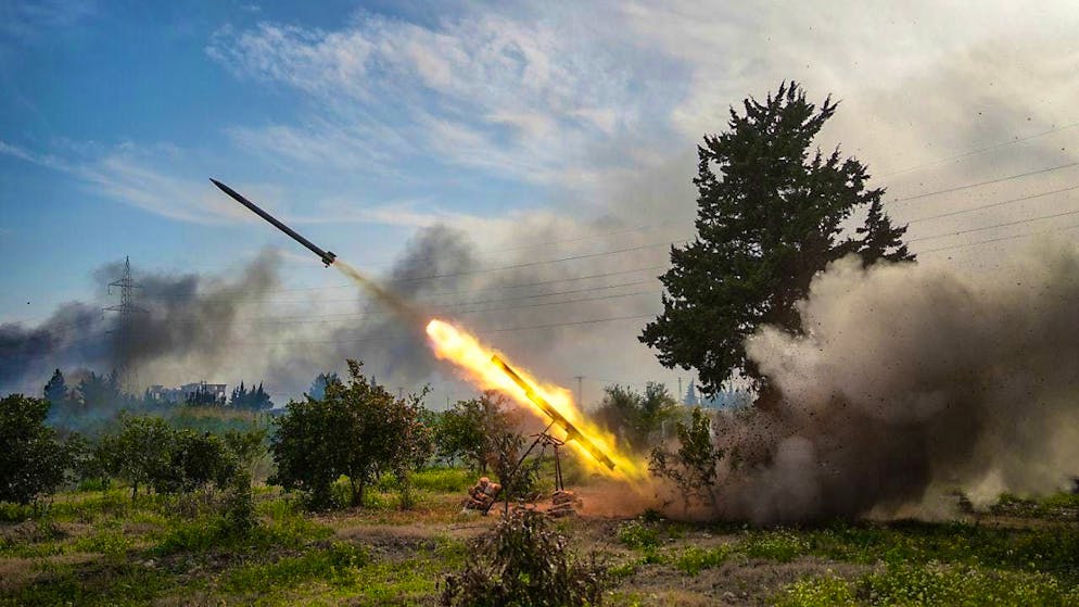 Syrian forces fire a missile at fighters linked to ousted Syrian President al-Assad. Photo: Moawia Atrash/dpa