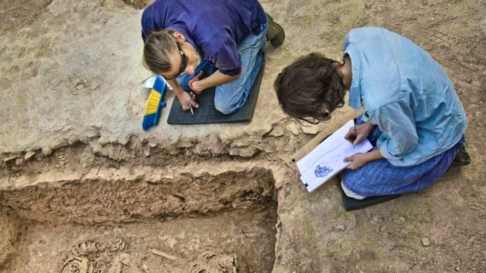 Archaeologists have found the body of a nun with heavy iron rings.