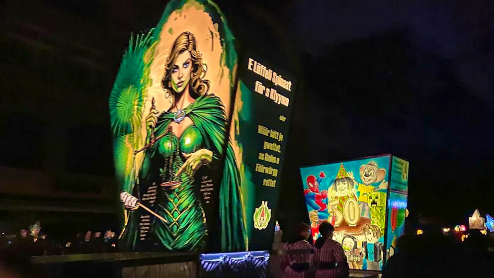 Thousands of carnival revellers parade through the streets and alleyways of Basel behind the large lanterns.