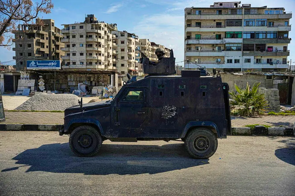 Syrian security forces patrol the town of Jableh in Latakia, Syria.