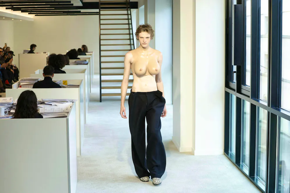 Designer Duran Lantink sent an optically male model with a female breast onto the catwalk at Paris Fashion Week.