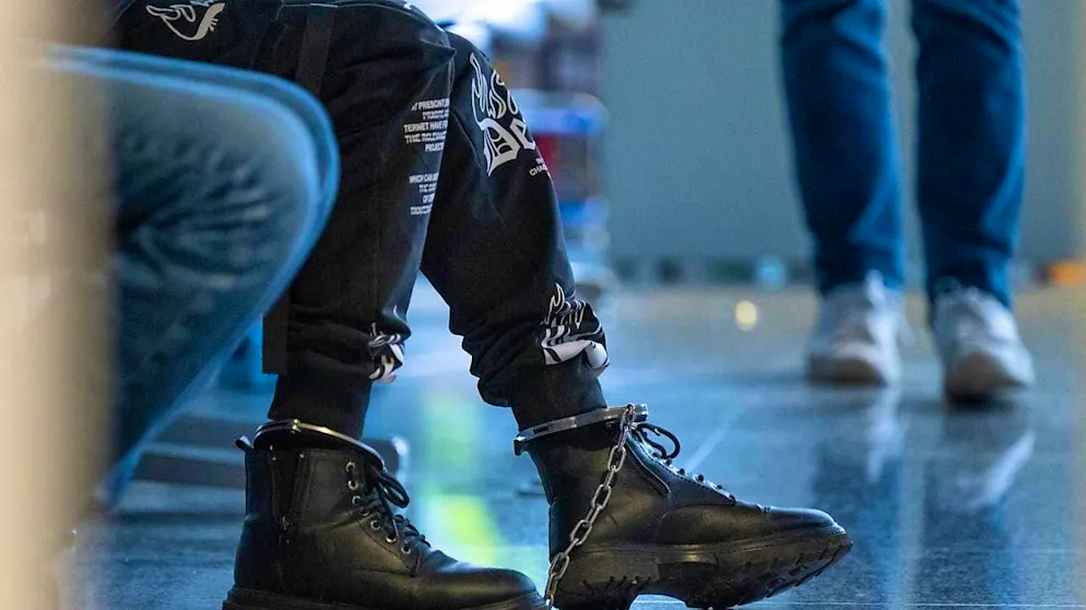 ARCHIVE - A Pakistani citizen wears leg irons before being deported on a deportation flight from Frankfurt to Islamabad. The Federal Police and Frontex staff accompany the flight with a massive deployment of forces. Photo: Boris Roessler/dpa