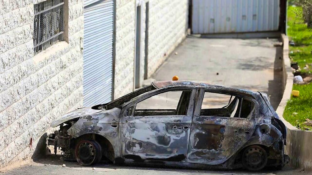 ARCHIVE - A view of a burnt and destroyed vehicle. Photo: Ayman Nobani/dpa