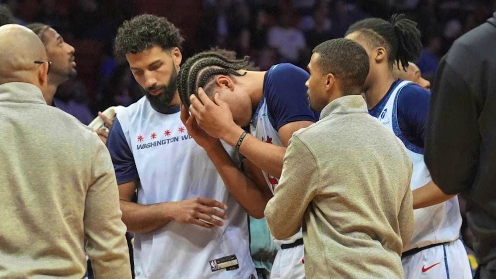 Kyshawn George (center) caused the Wizards' game against the Detroit Pistons to become hectic with a shove against Detroit star Cade Cunningham