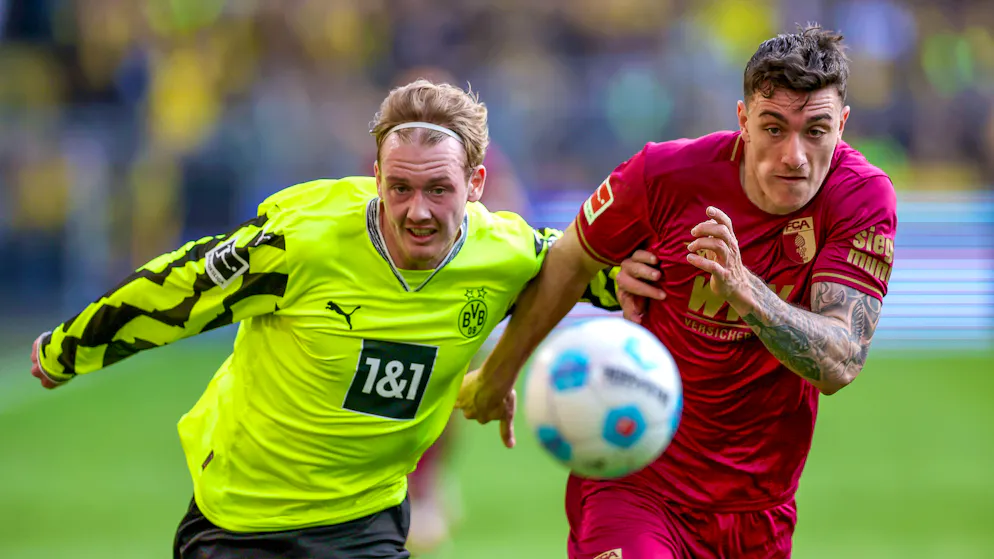 Cédric Zesiger (r.) im Duell mit Dortmunds Julian Brandt.